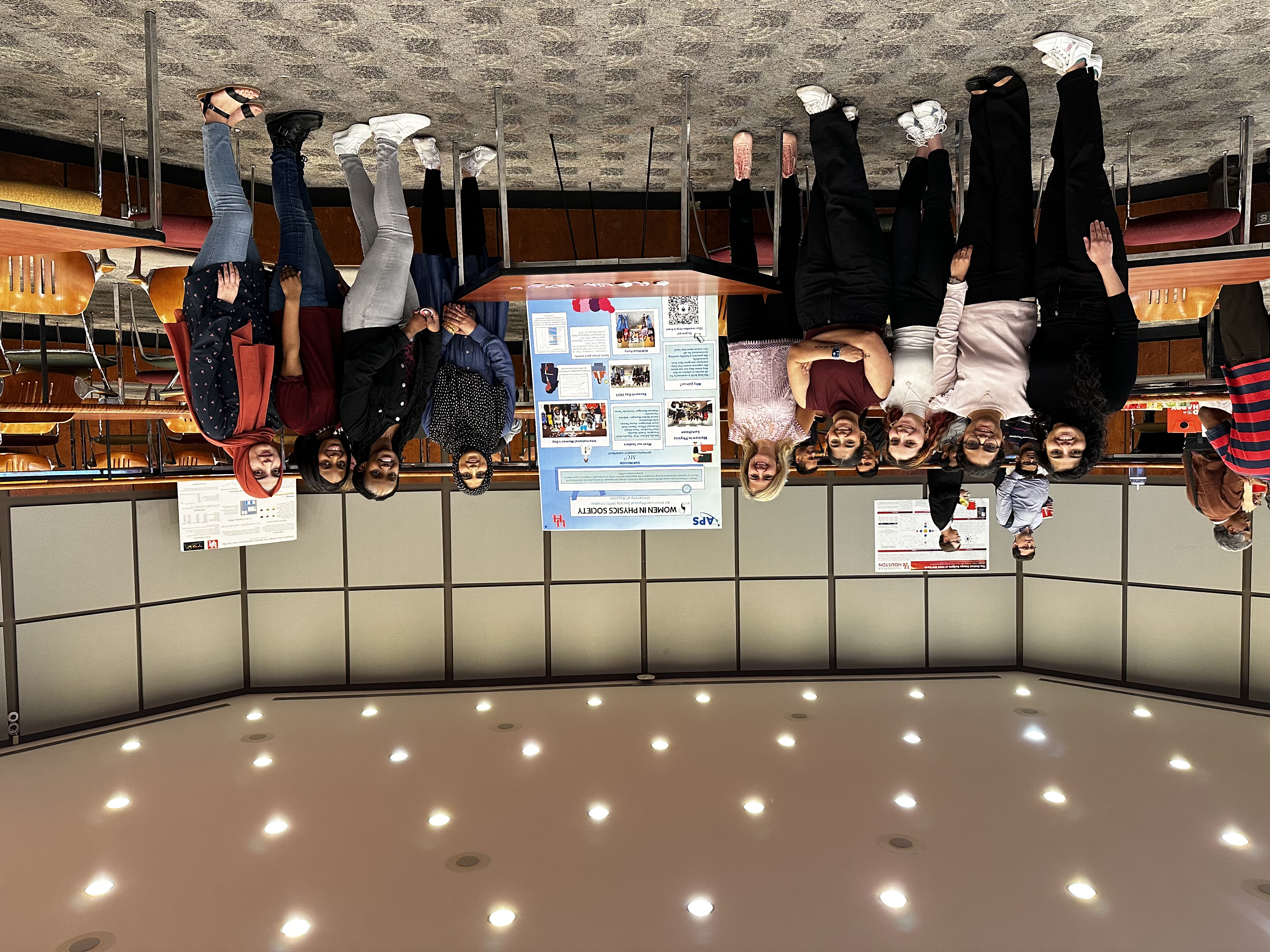 Women in Physics Society members beside their poster at University of Houston Research Day