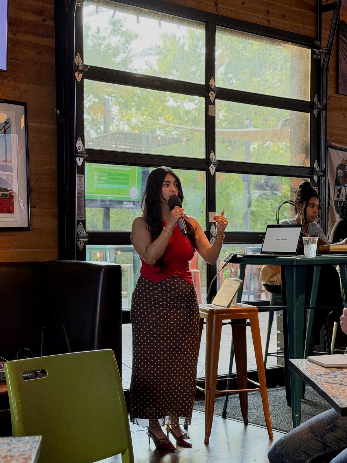 Prachi speaking about the arrow of time at After5 Society in Houston